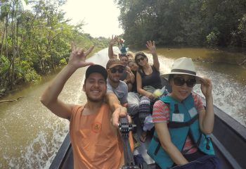 Tourists in the Cuyabeno River on their way to Laguna Grande
